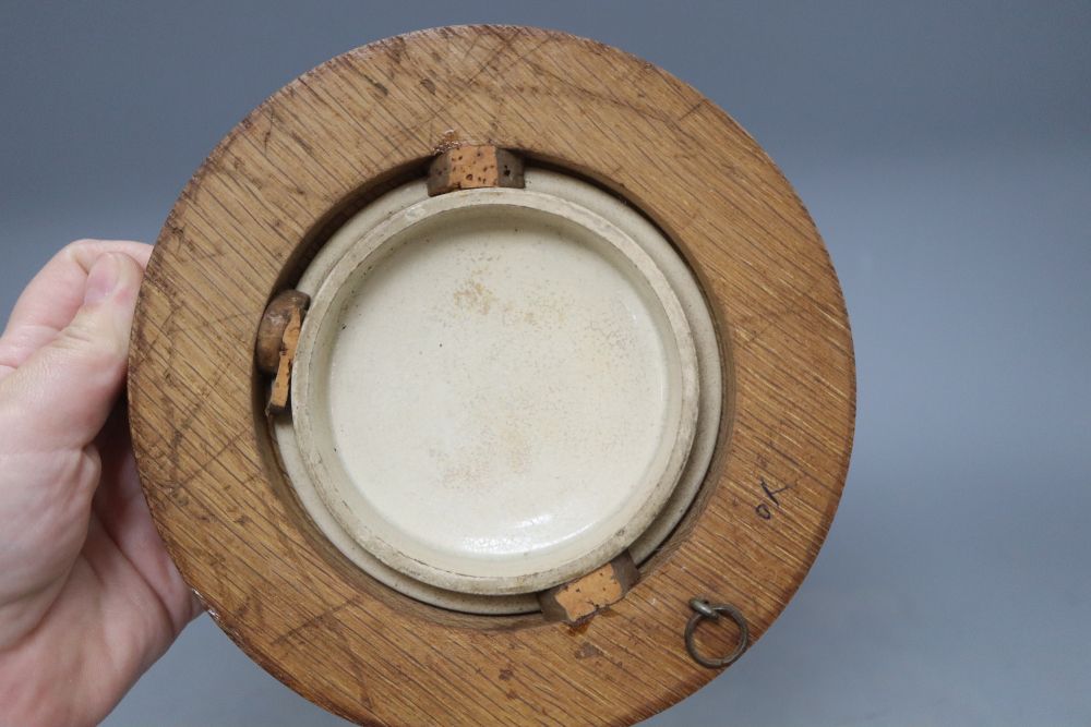 Three Prattware pot lids in oak frames and another Prattware pot